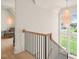 Light-filled upper hallway with a view and seating area at 8916 Grand Highland Way, Wake Forest, NC 27587