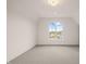 Spacious bedroom with neutral walls and a large window at 8916 Grand Highland Way, Wake Forest, NC 27587