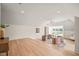 Versatile bonus room with hardwood floors, seating area, and natural light at 8916 Grand Highland Way, Wake Forest, NC 27587