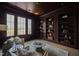 Sophisticated library with built-in bookshelves and a comfortable seating area at 8916 Grand Highland Way, Wake Forest, NC 27587