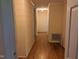 Simple hallway with light wood flooring and neutral walls at 4511 Hopson Rd, Morrisville, NC 27560