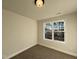 Bright bedroom with a large window offering wooded views at 97 Calluna Dr, Clayton, NC 27520