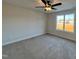 Spacious bedroom with carpeting, large window, and ceiling fan at 97 Calluna Dr, Clayton, NC 27520