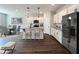 Virtually staged kitchen with island and stainless steel appliances at 97 Calluna Dr, Clayton, NC 27520