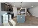 Modern kitchen with gray cabinets, granite countertops, and an island at 97 Calluna Dr, Clayton, NC 27520