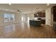 Open living room and kitchen with hardwood floors at 97 Calluna Dr, Clayton, NC 27520
