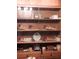 Wooden cabinet with various items, saws, and collectibles at 3007 Old Raleigh Rd, Apex, NC 27502
