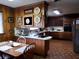 Kitchen features wood cabinets, a corner breakfast bar, and tile floors at 3007 Old Raleigh Rd, Apex, NC 27502
