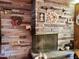 Stone fireplace with decorative wreaths and figurines at 3007 Old Raleigh Rd, Apex, NC 27502