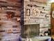 Stone fireplace with decorative wreaths and hunting rifle at 3007 Old Raleigh Rd, Apex, NC 27502