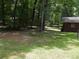 Spacious backyard with mature trees and grassy areas at 3007 Old Raleigh Rd, Apex, NC 27502