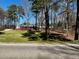 Ranch home nestled among tall trees and green grass at 3007 Old Raleigh Rd, Apex, NC 27502
