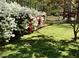 Landscaped yard with white and red azaleas at 3007 Old Raleigh Rd, Apex, NC 27502