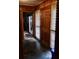 Entryway with wood paneling, slate floor, and interior doors at 3007 Old Raleigh Rd, Apex, NC 27502