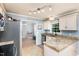 Spacious kitchen featuring granite countertops and light-colored cabinets at 2205 Moon Water Way, Garner, NC 27529