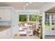 Kitchen with granite countertops, stainless steel appliances, and access to a deck at 2205 Moon Water Way, Garner, NC 27529
