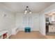 Dining room with view into kitchen and window at 2205 Moon Water Way, Garner, NC 27529