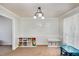 Bright dining room with built-in shelving and window at 2205 Moon Water Way, Garner, NC 27529