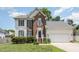 Two story brick and white sided home with attached garage at 2205 Moon Water Way, Garner, NC 27529