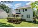 White two-story house with deck and green lawn at 2205 Moon Water Way, Garner, NC 27529