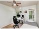 Bright bedroom with two windows, a desk, and a bed at 2205 Moon Water Way, Garner, NC 27529