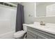 Clean bathroom with gray vanity and shower/tub at 2205 Moon Water Way, Garner, NC 27529