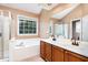 Bathroom with a double vanity, garden tub, and shower at 2205 Moon Water Way, Garner, NC 27529