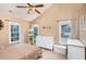 Main bedroom with high ceiling, dresser, and large windows at 2205 Moon Water Way, Garner, NC 27529