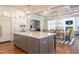 Modern kitchen with large island, hardwood floors, and high-end appliances at 410 Firefly Overlook, Pittsboro, NC 27312