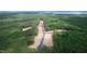 Aerial view of a new development featuring wooded lots and paved roads at 410 Firefly Overlook, Pittsboro, NC 27312