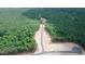 Aerial view of wooded area with new roads and cleared lots at 410 Firefly Overlook, Pittsboro, NC 27312