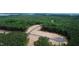 Aerial view of lots available near a lake in a wooded area at 410 Firefly Overlook, Pittsboro, NC 27312