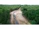 Aerial view of new construction road and lots in a wooded area at 410 Firefly Overlook, Pittsboro, NC 27312