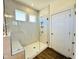 Large walk-in shower with tiled walls and a built-in seat at 117 Ausban Rdg Ln # 034, Four Oaks, NC 27524