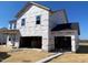 New construction home with wrap around porch and two car garage at 167 Bering Circle # 10, Angier, NC 27501