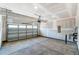 Unfinished garage with open floor plan and overhead door at 2023 Seneca Dr # 32, Raleigh, NC 27604