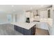 Modern kitchen with white cabinets and a large island at 2023 Seneca Dr # 32, Raleigh, NC 27604