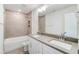Bathroom with double vanity, tub, and toilet at 2023 Seneca Dr # 32, Raleigh, NC 27604