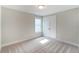 Bright bedroom with neutral walls and carpet flooring at 2023 Seneca Dr # 32, Raleigh, NC 27604