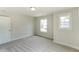 Bright bedroom with neutral carpeting, window, and ample natural light at 2023 Seneca Dr # 32, Raleigh, NC 27604
