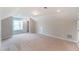 Spacious bedroom with window and carpet flooring at 2023 Seneca Dr # 32, Raleigh, NC 27604