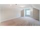 Bright bedroom with window and carpet flooring at 2023 Seneca Dr # 32, Raleigh, NC 27604