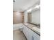 Modern bathroom with double vanity, large mirror, and shower at 2023 Seneca Dr # 32, Raleigh, NC 27604