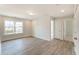 Bright and airy bedroom with neutral walls, hardwood floors, and ample closet space at 2023 Seneca Dr # 32, Raleigh, NC 27604