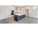 Modern kitchen with white cabinets and a large island at 2023 Seneca Dr # 32, Raleigh, NC 27604