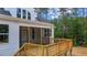 Wooden deck with stairs and screened porch at 190 Whistlers Cv, Louisburg, NC 27549