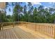 New home deck overlooking wooded area at 190 Whistlers Cv, Louisburg, NC 27549