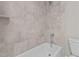 Bathroom with bathtub and shower, grey tile surround at 190 Whistlers Cv, Louisburg, NC 27549