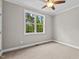 Spacious bedroom with carpeted floor and ceiling fan at 190 Whistlers Cv, Louisburg, NC 27549