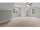 Spacious bedroom with carpet, ceiling fan and large windows at 190 Whistlers Cv, Louisburg, NC 27549